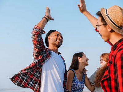 adults high five each other